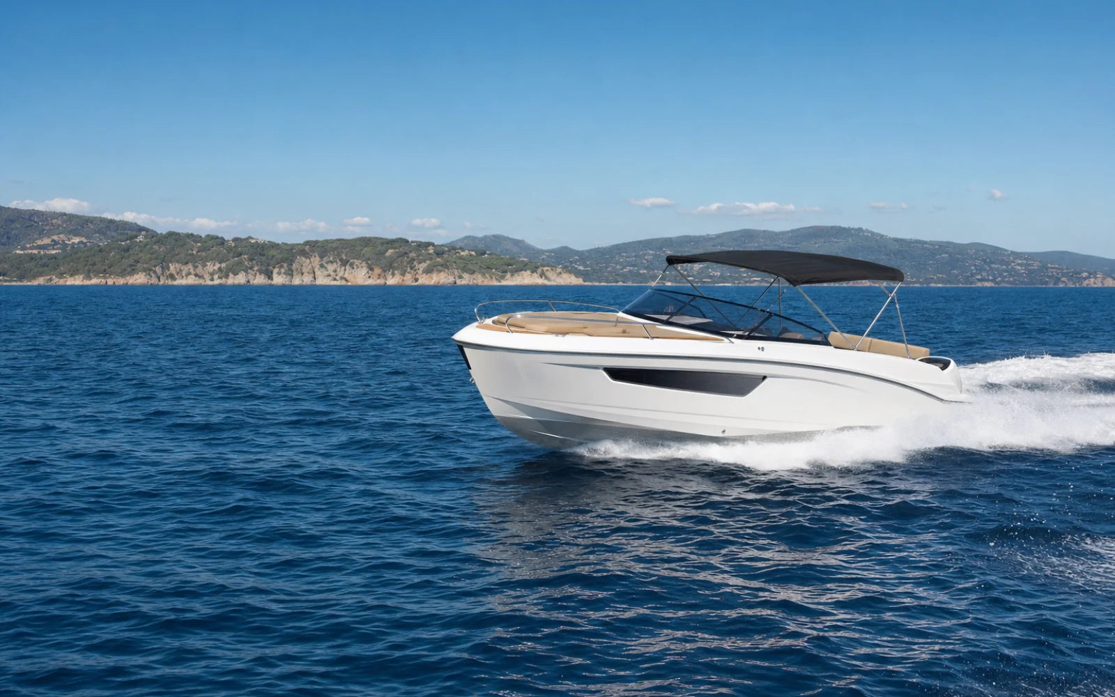 Used white motorboat cruising on the Mediterranean Sea